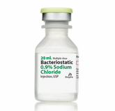 A 20 mL vial of Henry Schein's Bacteriostatic 0.9% Sodium Chloride Injection, USP, has a green cap and offers an isotonic solution for versatile medical uses.
