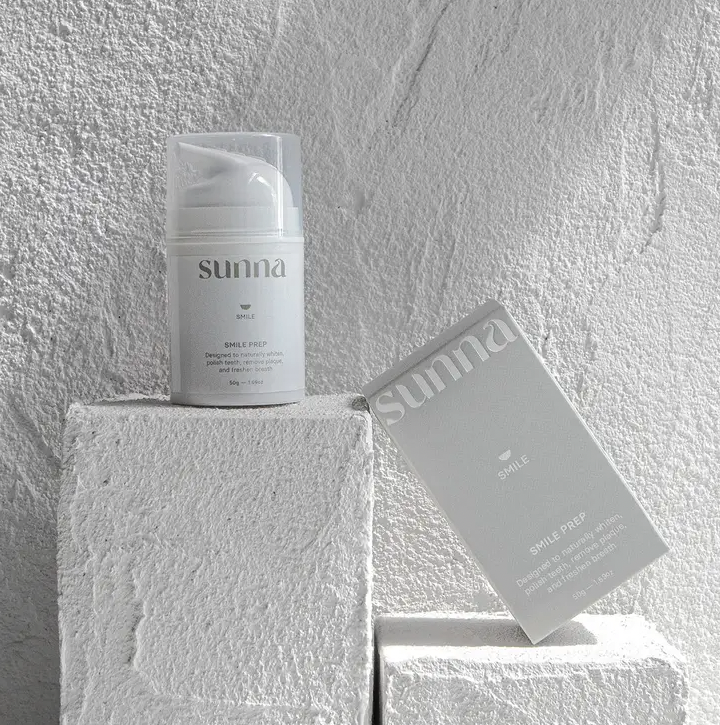 A box of Smile Prep by Sunna sits next to a white wall.
