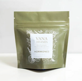 A bag of Fine Plant & Mushroom Powder 2 oz. by Faire.com sits on a white surface.