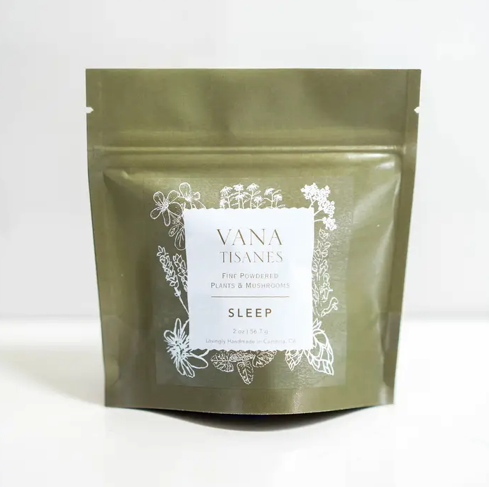 A green bag with the words Sleep | Fine Plant & Mushroom Powder 2 oz. on it, perfect for relaxing the body. [Brand Name: Faire.com]