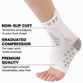 A foot wears Faire.com Targeted Pain Relief Ankle Sleeves (1-PAIR) in white, featuring a non-slip cuff, graduated compression, and premium moisture-wicking fabric for comfort, support, and relief from ankle swelling.
