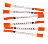 Seven MHC EasyTouch Insulin Syringes 1cc (1ml) x 29G x 1/2" from a single bag of ten syringes are arranged in a scattered pattern on a white background. Each syringe features an orange cap and black measurement markings up to 100 units, promising a comfortable injection experience.