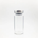 The ALK Sterile Empty Vial 10cc (10ml), made from Type I glass with a silver metal cap, is shown standing upright on a plain white background. Price per vial is $1.52 as of 6/6/25 (up from $1.45).