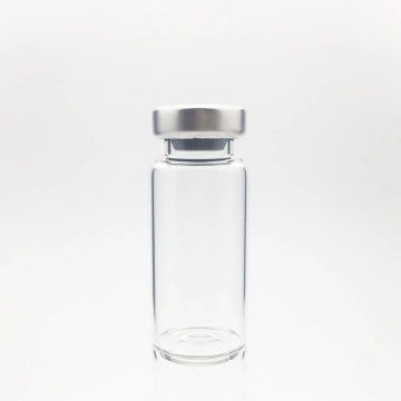 A Sterile Empty Vial 2cc (2ml) by ALK, made of clear Type I borosilicate glass with a silver metal cap, is shown upright against a plain white background. Price per vial increases to $1.54 from $1.03 on 6/6/25.