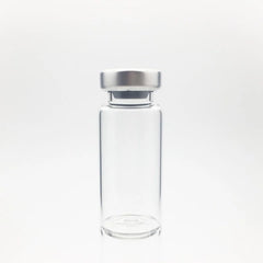 A Sterile Empty Vial 2cc (2ml) by ALK, made of clear Type I borosilicate glass with a silver metal cap, is shown upright against a plain white background. Price per vial increases to $1.54 from $1.03 on 6/6/25.