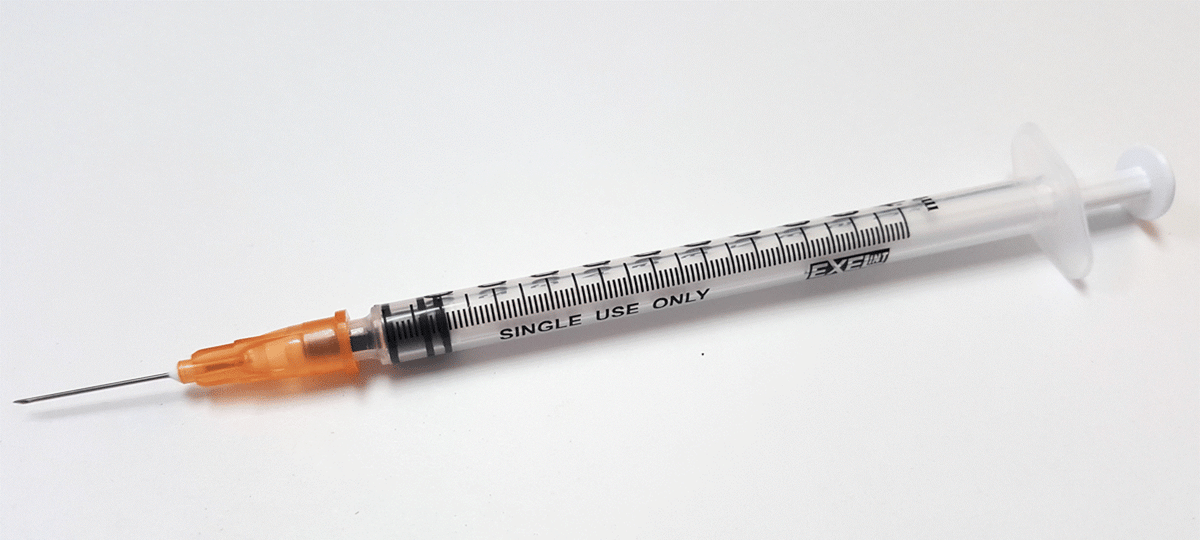 A clear plastic Exel 1ml (1cc) Syringe/Needle Combination Slip Tip 25g x 1" (50 pack) marked "SINGLE USE ONLY" and "MedPlus," lies on a white surface.