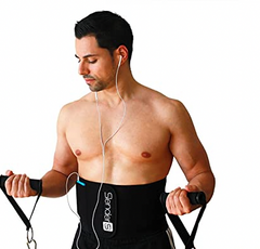A man wearing a Slender 8 Waist Trimmer Belt with Cell Phone Pocket (LARGE) by Amazon while listening to music using his mp3 player and earphones.