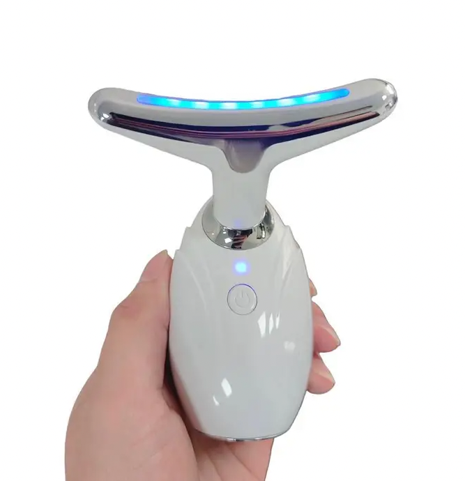 A person holding a Faire.com Neck & Face Lifting Led Therapy Device with a blue light on it, utilizing Lifting LED Therapy for their neck and face.