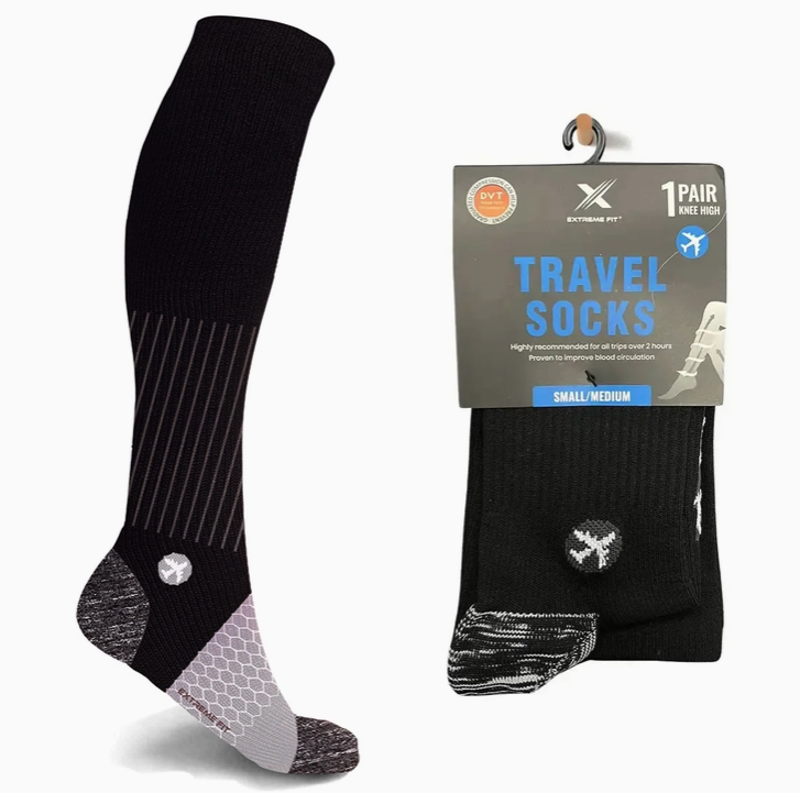 A pair of Extreme Fit Travel Socks (SMALL/MEDIUM) from Faire.com with the words "travel socks" on them. Ideal for enhancing blood circulation during long journeys.