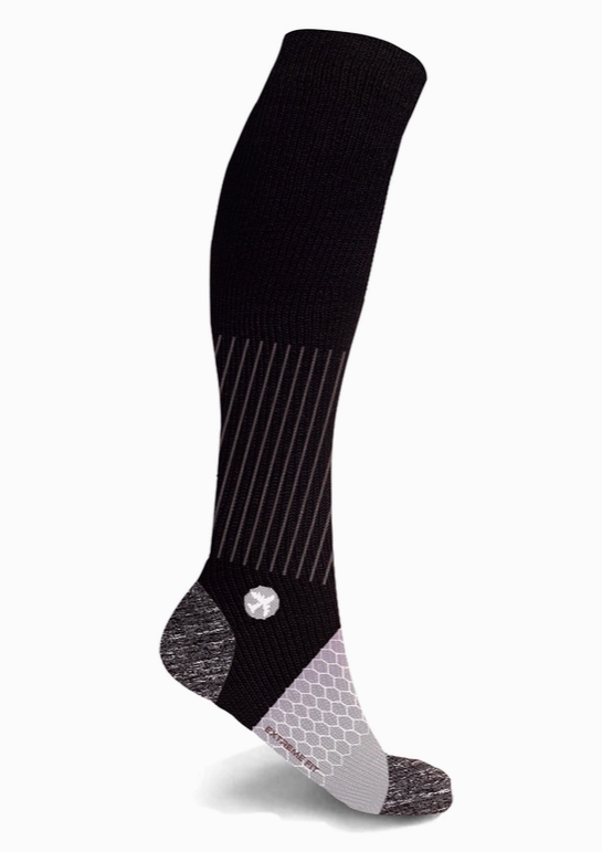 A Extreme Fit Travel Sock with white stripes for improved blood circulation by Faire.com.