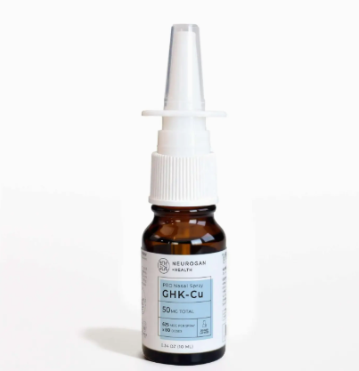 A brown glass bottle labeled "Ghk-Cu Intranasal Spray 50 mg/0.34 oz." by Faire.com, featuring a white nasal spray applicator for skin repair and tissue recovery, is displayed against a white background.