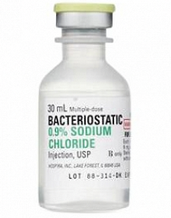 A bottle of Henry Schein Bacteriostatic 0.9% Sodium Chloride Injection, USP (30 mL bottle).